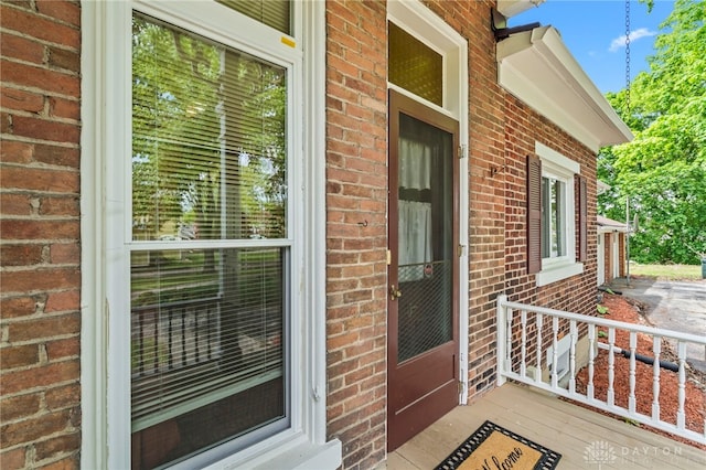 654 S Market St, Troy, OH 45373 - property entrance featuring brick siding