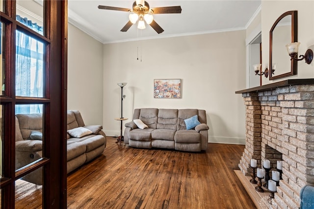 654 S Market St, Troy, OH 45373 - living area featuring dark wood-style floors, a ceiling fan, baseboards, ornamental molding, and a fireplace