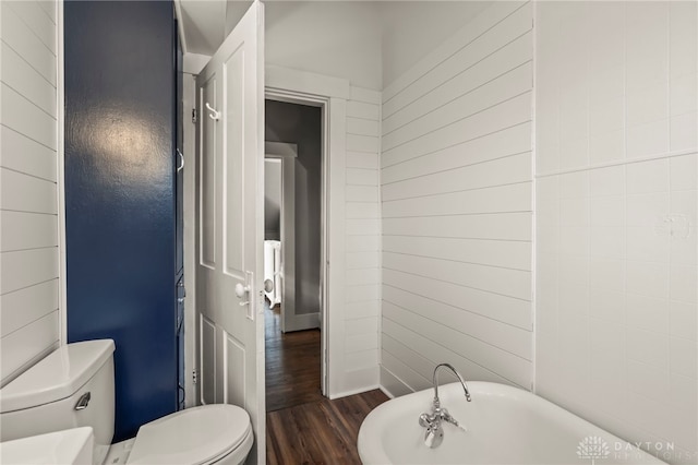 654 S Market St, Troy, OH 45373 - full bath featuring a freestanding bath, toilet, and wood finished floors