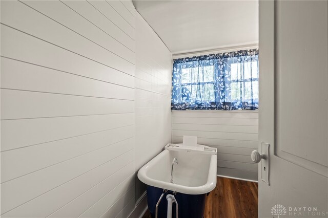 654 S Market St, Troy, OH 45373 - bathroom featuring wood finished floors and a freestanding bath
