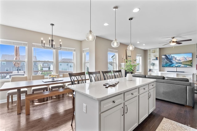 1591 Windham Ln, Beavercreek Township, OH 45385 - kitchen featuring open floor plan, dark wood-style floors, a kitchen island, white cabinets, and a ceiling fan