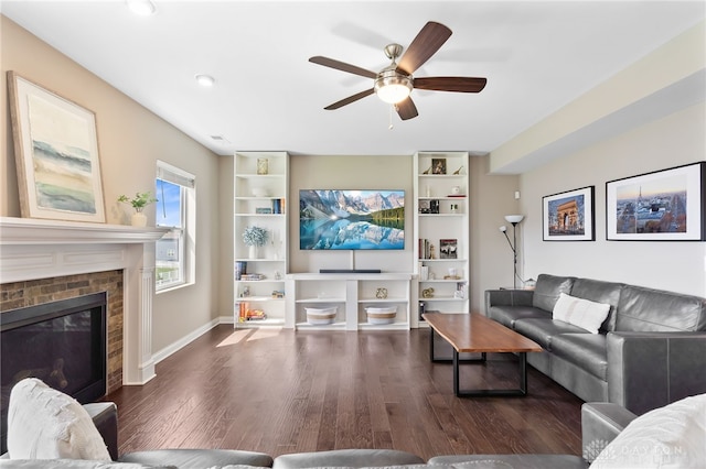 1591 Windham Ln, Beavercreek Township, OH 45385 - living room featuring wood finished floors, a ceiling fan, a fireplace, and built in shelves