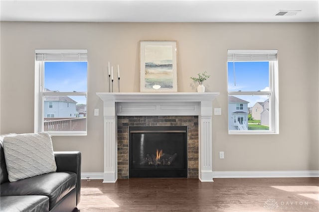 1591 Windham Ln, Beavercreek Township, OH 45385 - living area with a fireplace, wood finished floors, and baseboards