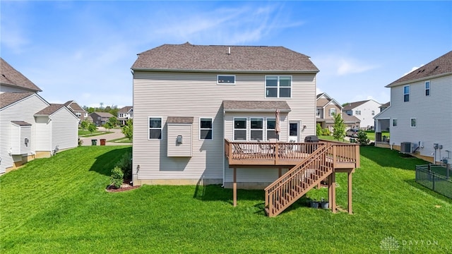 1591 Windham Ln, Beavercreek Township, OH 45385 - rear view of house with a residential view, a deck, a yard, and cooling unit