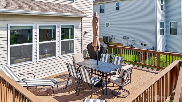 1591 Windham Ln, Beavercreek Township, OH 45385 - wooden deck with outdoor dining space and central AC