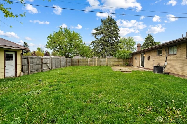 view of yard with a patio area and central AC unit