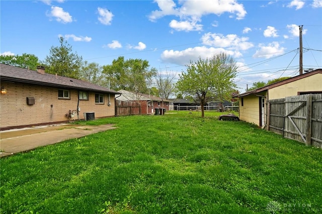 view of yard featuring central air condition unit