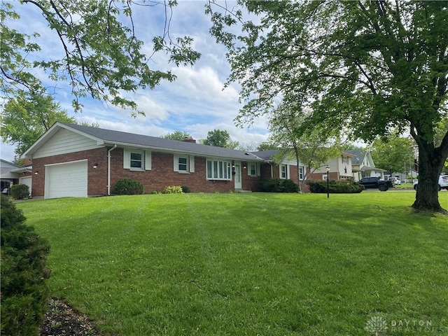 single story home with brick siding, a garage, a front yard, and a chimney