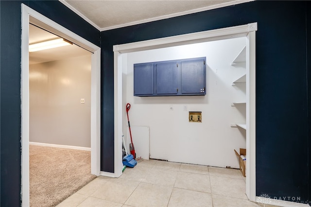 laundry room with light tile patterned floors, washer hookup, light carpet, ornamental molding, and baseboards