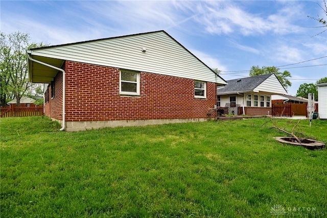rear view of house with brick siding
