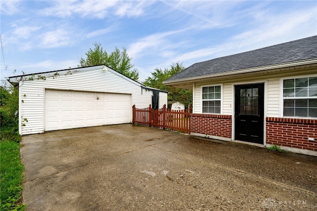 detached garage with fence
