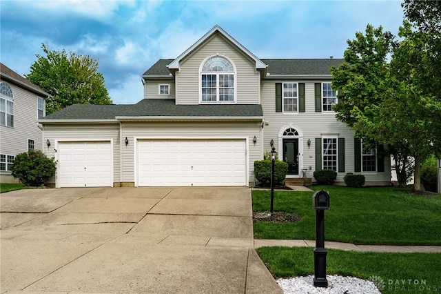 48 Crockett Dr, Springboro, OH 45066 - view of front of property featuring concrete driveway, a front lawn, and an attached garage