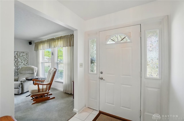 3352 Morning Glory Rd, Dayton, OH 45449 - entryway with light tile patterned floors, baseboards, and light colored carpet