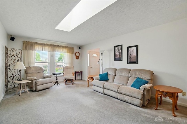 3352 Morning Glory Rd, Dayton, OH 45449 - living room with baseboards, a textured ceiling, carpet floors, and a skylight