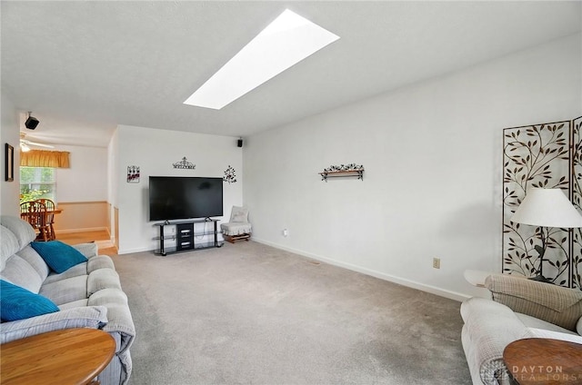3352 Morning Glory Rd, Dayton, OH 45449 - living area with a skylight, carpet floors, and baseboards