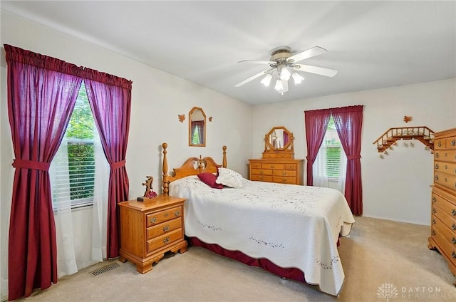 3352 Morning Glory Rd, Dayton, OH 45449 - bedroom with light carpet and a ceiling fan