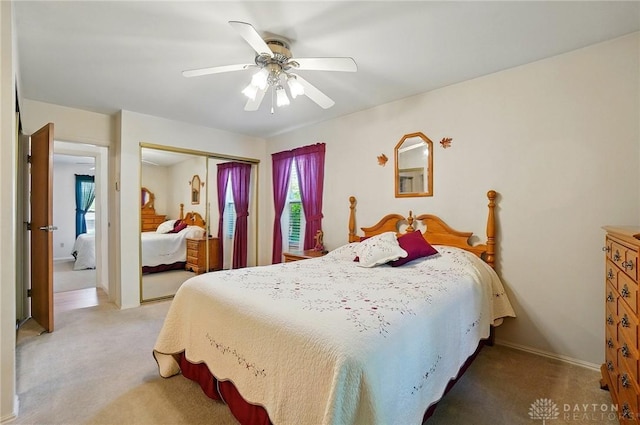 3352 Morning Glory Rd, Dayton, OH 45449 - bedroom with light carpet, a closet, ceiling fan, and baseboards