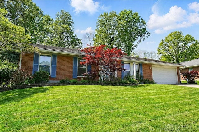 3352 Morning Glory Rd, Dayton, OH 45449 - ranch-style house with brick siding, a garage, a front yard, and concrete driveway