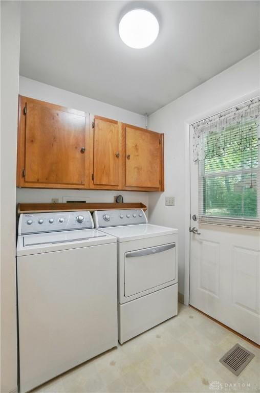 3352 Morning Glory Rd, Dayton, OH 45449 - clothes washing area with washer and clothes dryer, cabinet space, and light flooring