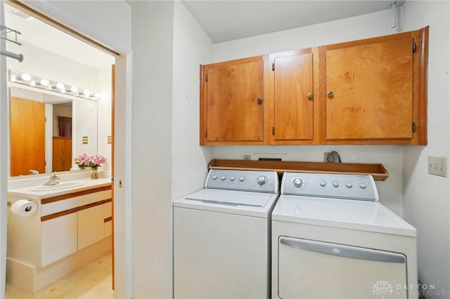 3352 Morning Glory Rd, Dayton, OH 45449 - clothes washing area with independent washer and dryer and cabinet space
