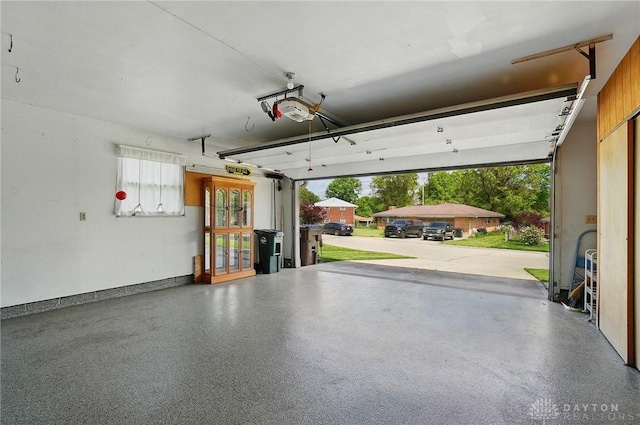 3352 Morning Glory Rd, Dayton, OH 45449 - garage with a garage door opener and french doors