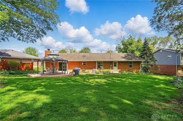 3352 Morning Glory Rd, Dayton, OH 45449 - back of house with a gazebo, a patio area, and brick siding