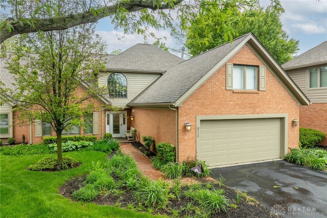 813 Timberlake Ct, Kettering, OH 45429 - traditional home featuring brick siding, driveway, and roof with shingles