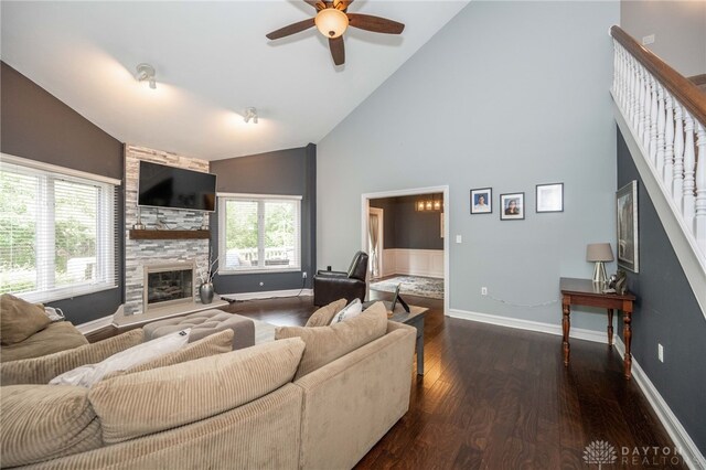 813 Timberlake Ct, Kettering, OH 45429 - living room with high vaulted ceiling, dark wood-style floors, a ceiling fan, a large fireplace, and baseboards