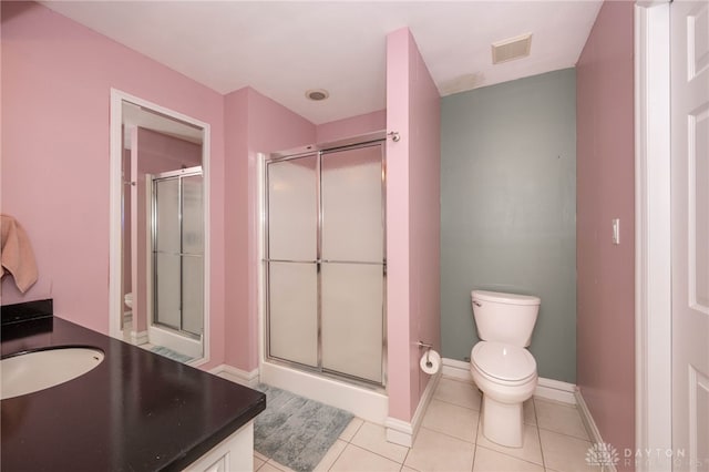 813 Timberlake Ct, Kettering, OH 45429 - bathroom with toilet, a shower stall, vanity, tile patterned floors, and baseboards
