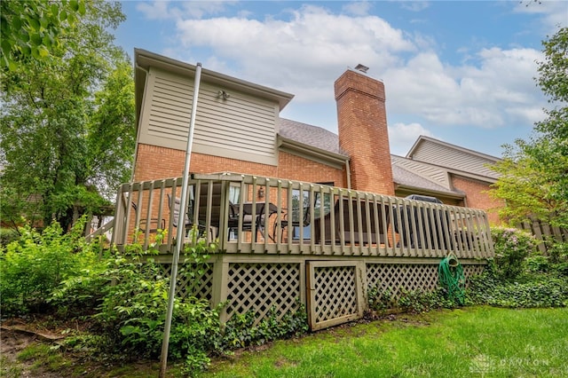 813 Timberlake Ct, Kettering, OH 45429 - back of property featuring brick siding, a deck, and a chimney