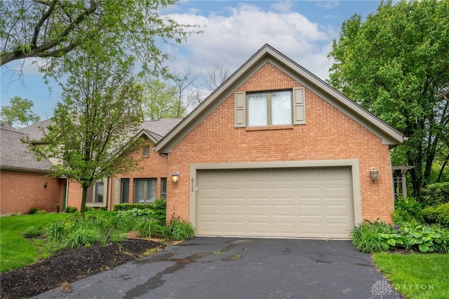 813 Timberlake Ct, Kettering, OH 45429 - traditional-style house featuring brick siding, a garage, and asphalt driveway