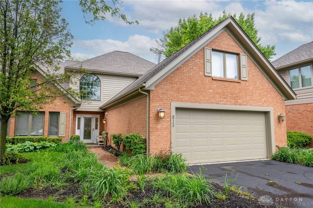 813 Timberlake Ct, Kettering, OH 45429 - traditional home featuring brick siding, asphalt driveway, and a shingled roof