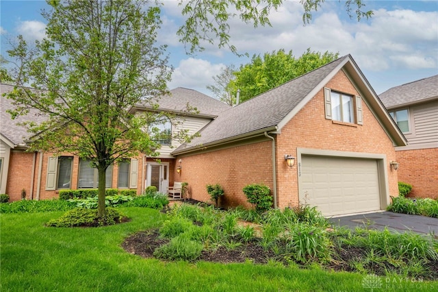 813 Timberlake Ct, Kettering, OH 45429 - view of side of home with asphalt driveway, brick siding, a garage, and roof with shingles