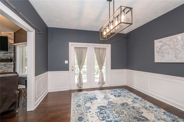 813 Timberlake Ct, Kettering, OH 45429 - dining room featuring wainscoting, wood finished floors, and a chandelier