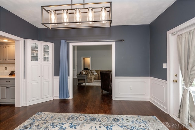 813 Timberlake Ct, Kettering, OH 45429 - unfurnished dining area with wood finished floors and a wainscoted wall