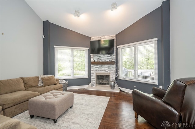 813 Timberlake Ct, Kettering, OH 45429 - living area with vaulted ceiling, a large fireplace, wood finished floors, and baseboards