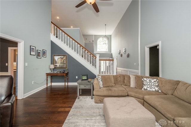 813 Timberlake Ct, Kettering, OH 45429 - living area featuring wood finished floors, ceiling fan, stairway, a chandelier, and a towering ceiling