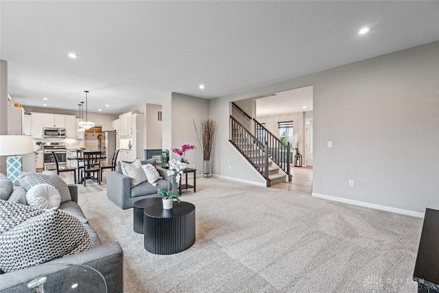 1239 Champion Way, Washington Twp, OH 45458 - living room featuring recessed lighting, stairs, light carpet, and baseboards