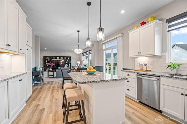 1239 Champion Way, Washington Twp, OH 45458 - kitchen featuring stainless steel dishwasher, white cabinets, a kitchen island, light wood finished floors, and recessed lighting