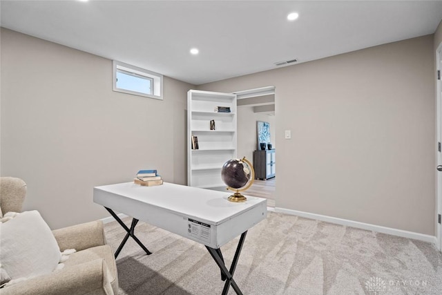 home office featuring baseboards, light carpet, and recessed lighting