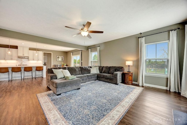 3732 Oak Creek Dr, Sugarcreek Township, OH 45440 - living area with a ceiling fan, wood finished floors, and baseboards