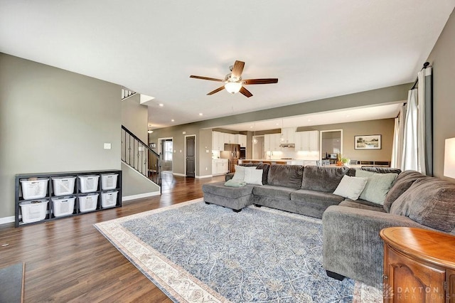 3732 Oak Creek Dr, Sugarcreek Township, OH 45440 - living room with a ceiling fan, dark wood-style flooring, baseboards, and stairs