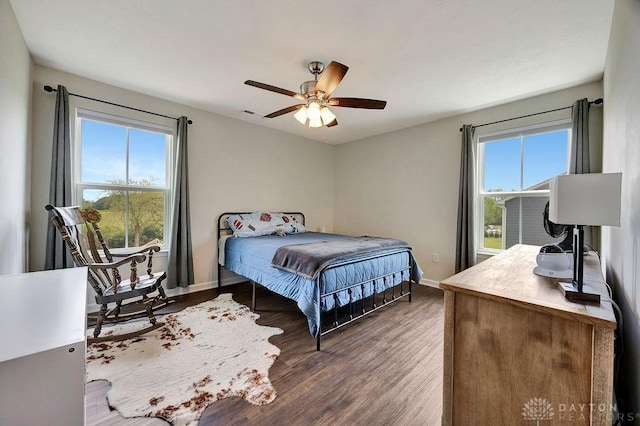 3732 Oak Creek Dr, Sugarcreek Township, OH 45440 - bedroom featuring baseboards, wood finished floors, and a ceiling fan