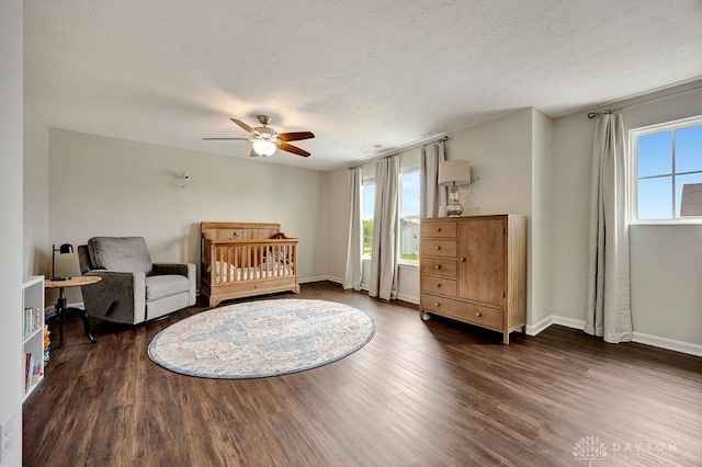 3732 Oak Creek Dr, Sugarcreek Township, OH 45440 - bedroom with dark wood-style flooring, multiple windows, baseboards, and a textured ceiling