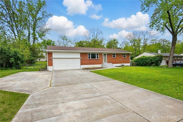 3700 Echo Hill Ln, Beavercreek, OH 45430 - ranch-style home featuring brick siding, an attached garage, and concrete driveway
