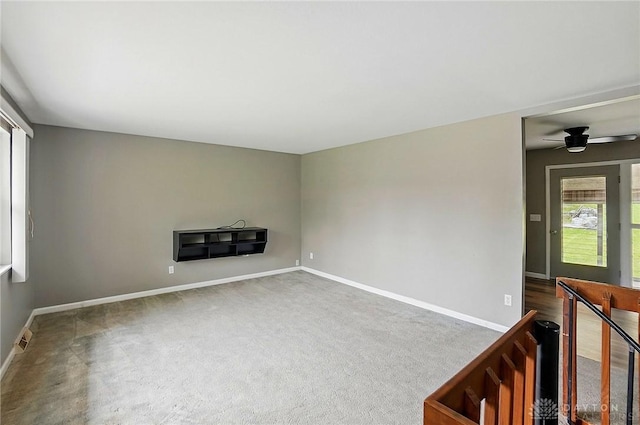 3700 Echo Hill Ln, Beavercreek, OH 45430 - unfurnished living room with baseboards, carpet flooring, and a ceiling fan