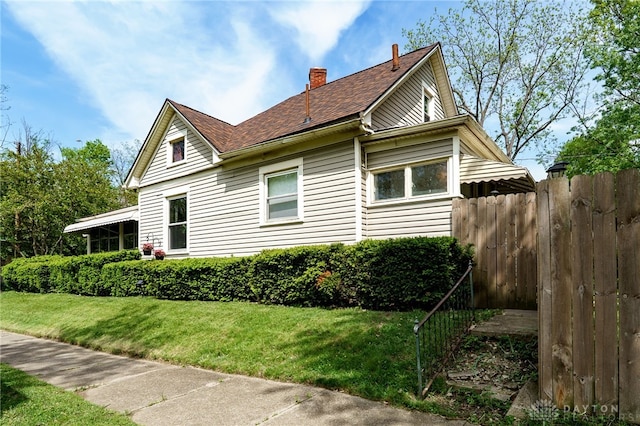 1000 Haviland Ave, Dayton, OH 45410 - view of property exterior with a chimney and roof with shingles