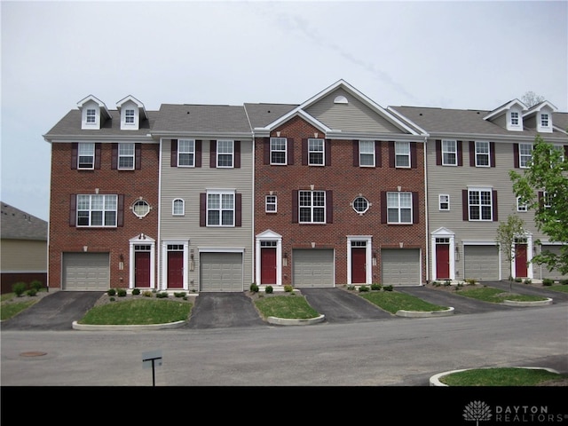 4324 Straight Arrow Rd, Beavercreek, OH 45430 - townhome / multi-family property with driveway, an attached garage, and brick siding