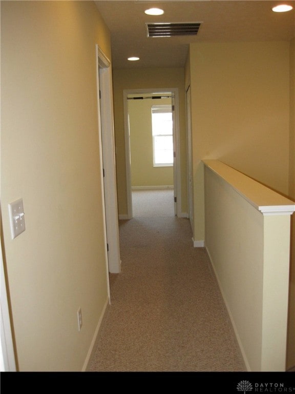 4324 Straight Arrow Rd, Beavercreek, OH 45430 - corridor featuring light carpet, recessed lighting, an upstairs landing, and baseboards