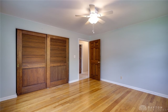 200 S Village, Washington Twp, OH 45459 - unfurnished bedroom featuring a closet, light wood-style floors, baseboards, and a ceiling fan